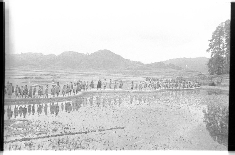 Apatani crowd accompanying Christoph von Fürer-Haimendorf through the Apatani valley - 