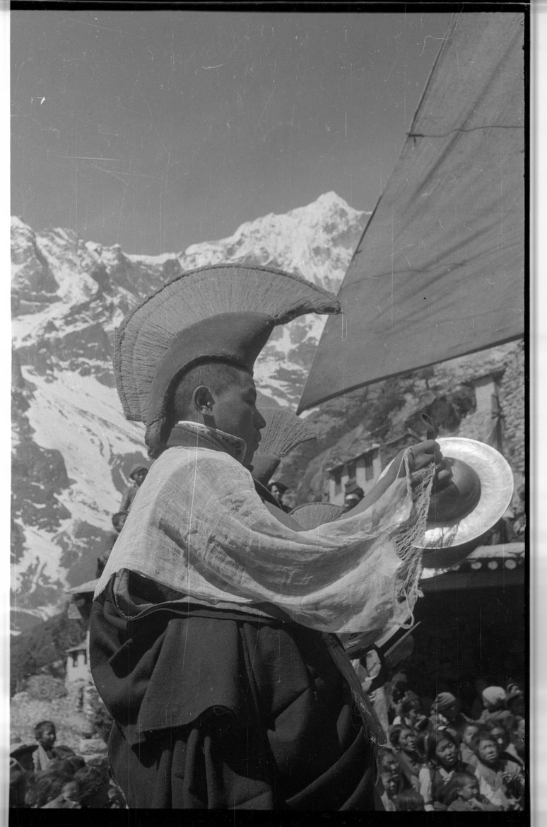 Mani Rimdu at Thami - Monk playing cymbals - 