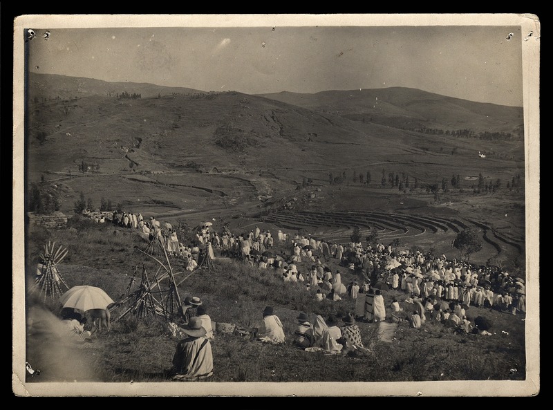 People sitting on hillside - 