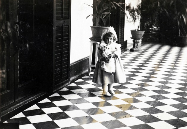 Photograph, a girl and her doll