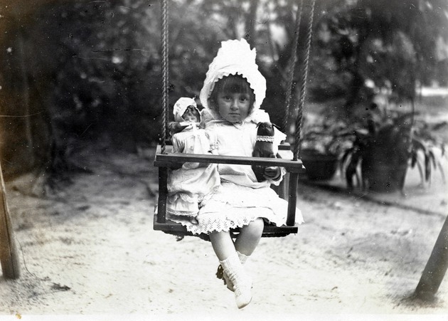 Photograph, a girl in a swing