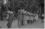 Group of Sinhala adults and children playing