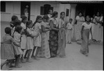 Group of Sinhala adults and children at play